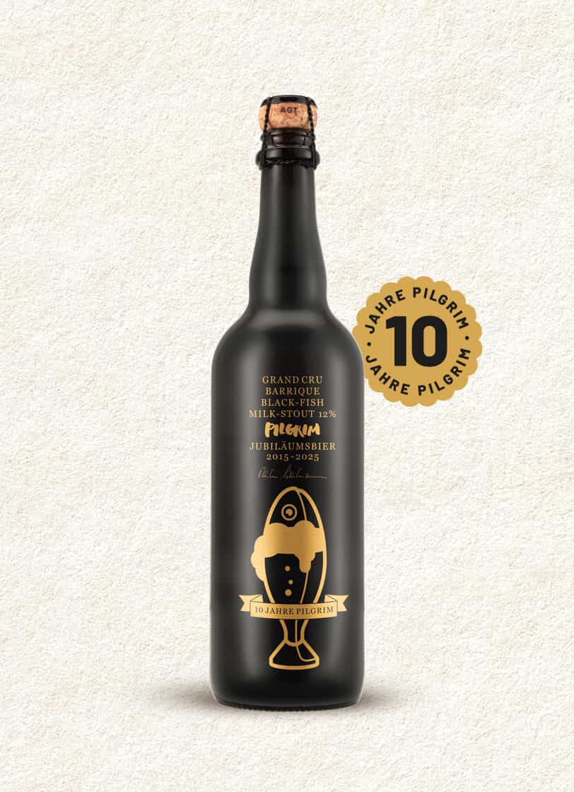 Schwarze 75 cl Flasche Jubiläumsbier 2025 Blackfish mit goldfarbenem Raumschiff-Logo und 12% Alkoholangabe.